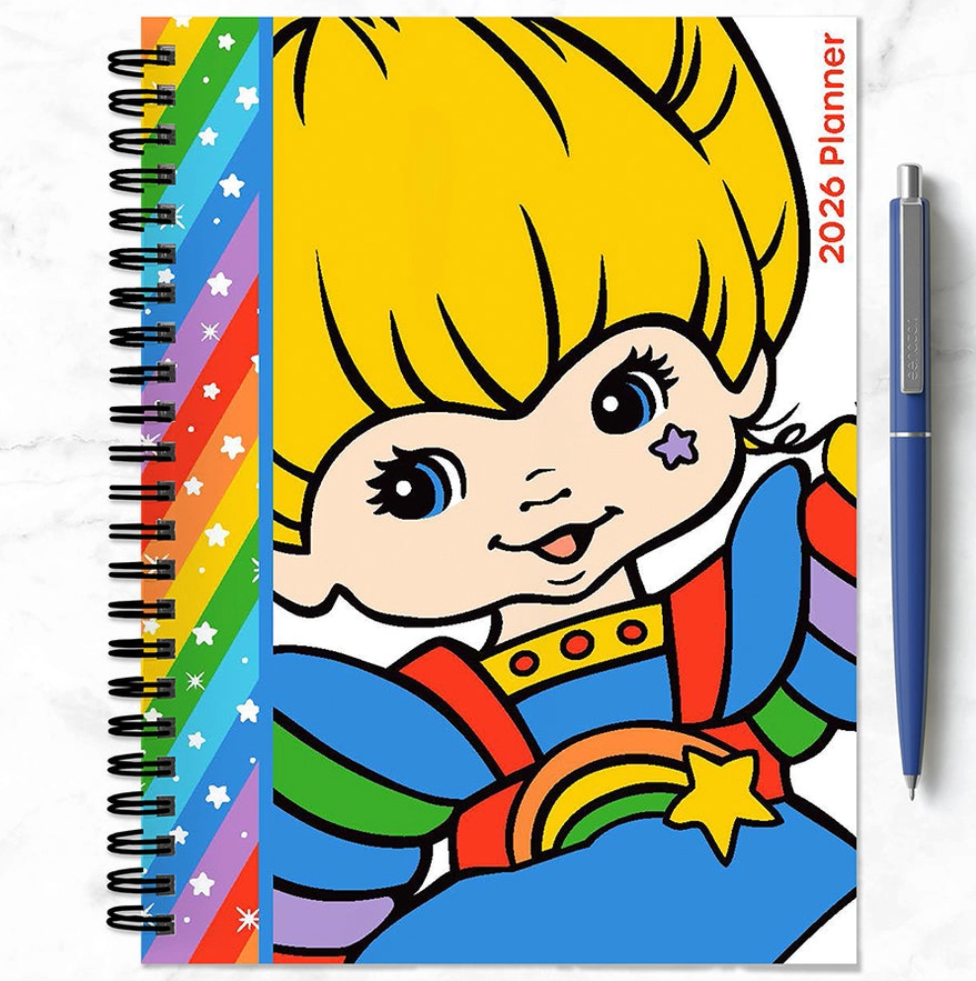 2026 Rainbow Brite weekly monthly planner featuring bright character artwork and rainbow stripe accents.