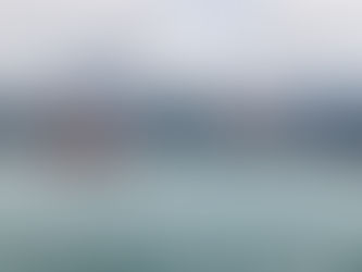 Hong Kong skyline with a traditional Junk boat sailing by