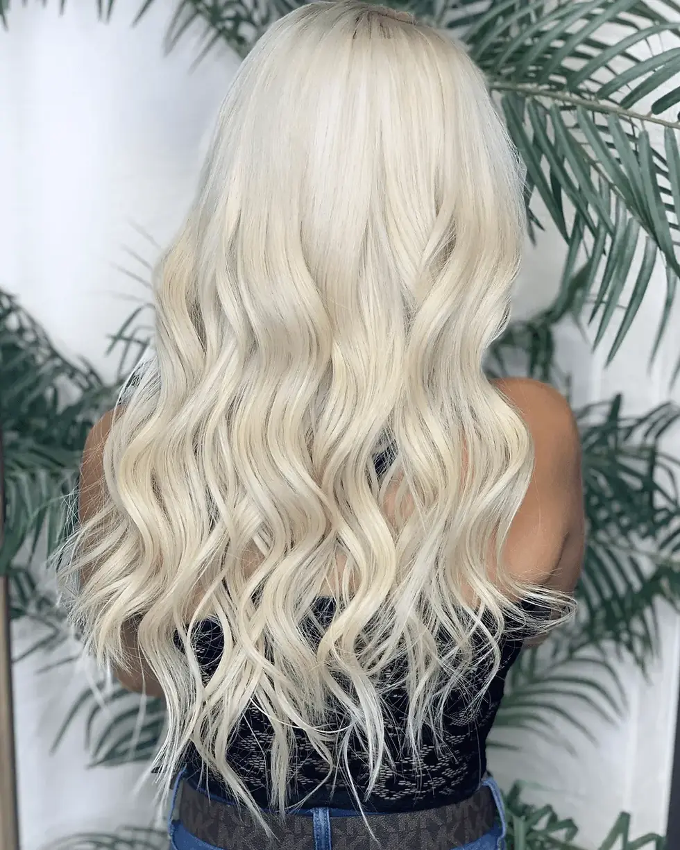 Blonde hair extension result with soft waves