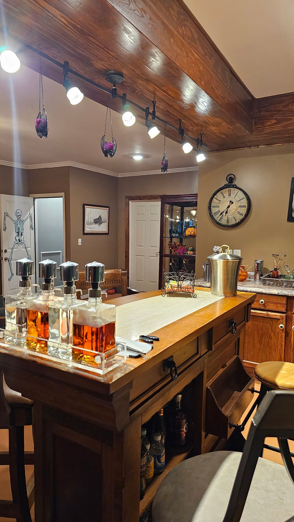 Custom kitchen bar with wood beams and decanters by PROFESSIONAL TOUCH REMODELING & CARPENTRY LLC