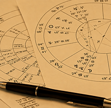 Astrology Charts and Pen.png