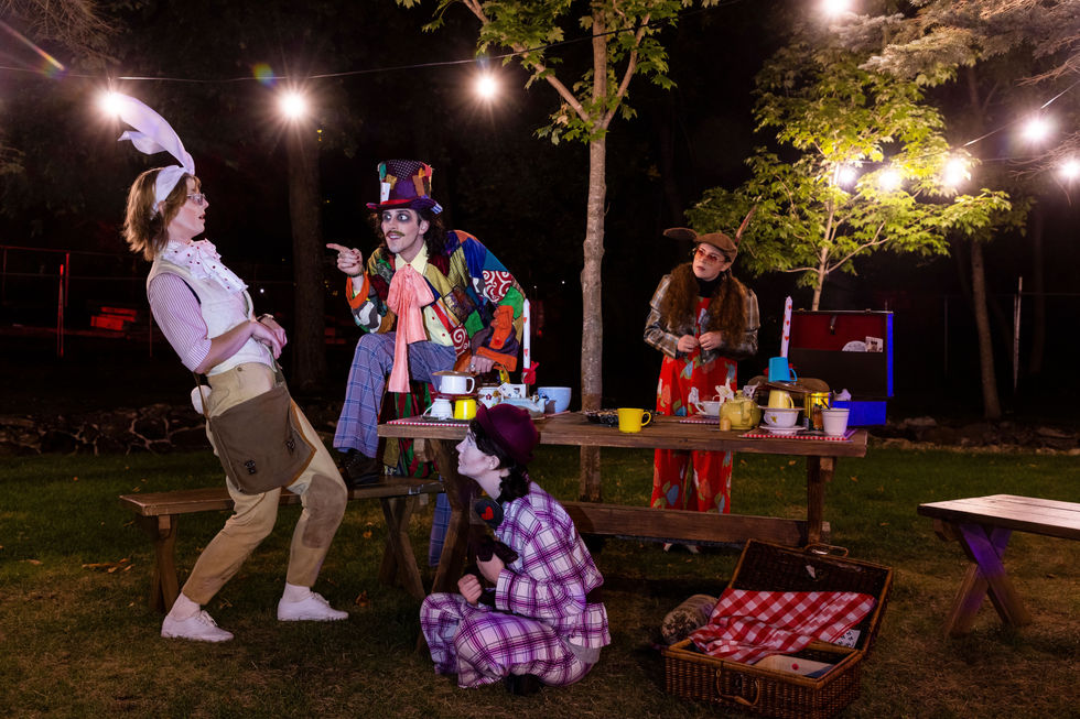 Tea party with show characters. Table precariously stacked with carefully chosen props to encapsulate the characters and the environment they exist in.