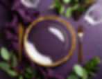 Firefly_clear plate with a gold rough painted looking trim on a table with a dark purple t