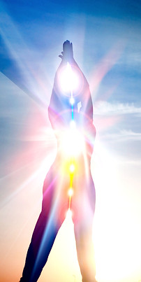 Silhouette of a radiant human figure with illuminated chakras and light body activation, symbolizing the energetic alignment, chakra clearing, and spiritual transformation offered through Axis of Light’s remote energy healing services