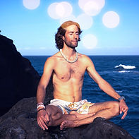 Meditating man by ocean — grounding energy through Earth connection, restoring balance and inner peace after spiritual interference