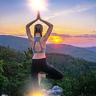 Woman practicing yoga in mountain light — clearing energetic implants and AI interference from the aura for EMF detox, mental clarity, and energetic sovereignty