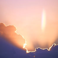 Clouds with silver lining and radiant flare — symbolic of program removal, subconscious clearing, and releasing spiritual interference to support energy field healing and higher consciousness