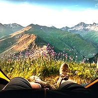 Person relaxing in mountain stillness – energetic cord and attachment clearing for emotional freedom. mental clarity, and peace