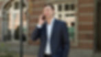 Professional accountant talking to a client outside of an office building