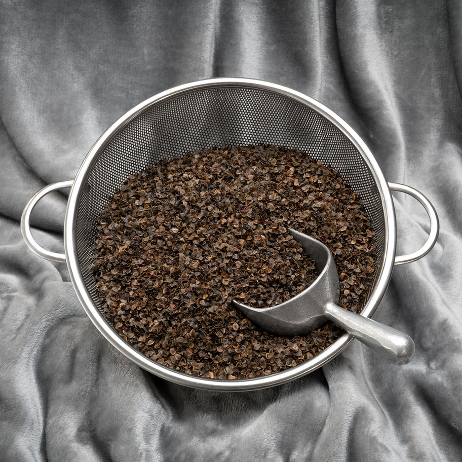 Organic buckwheat hulls in a colander