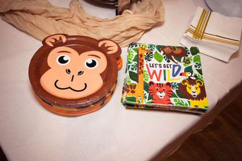 a stack of paper plates and napkins that say let 's get wild