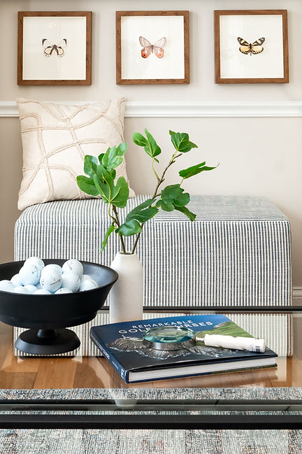striped bench, golf ball decorations and butterfly wall art