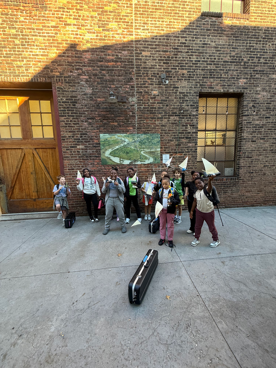 Sailing Academy group with flags posing outdoors