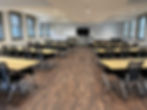Flexible event space with tables and chairs
