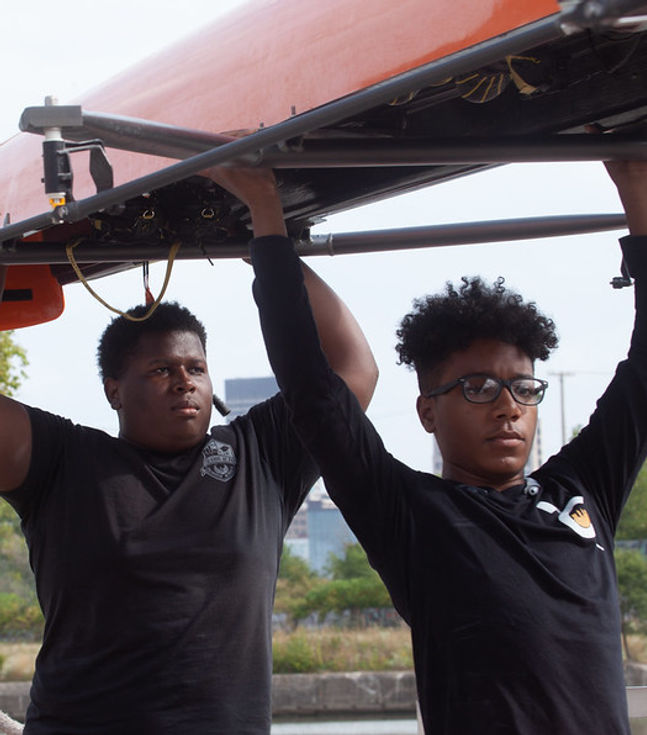 Kids carrying row boat
