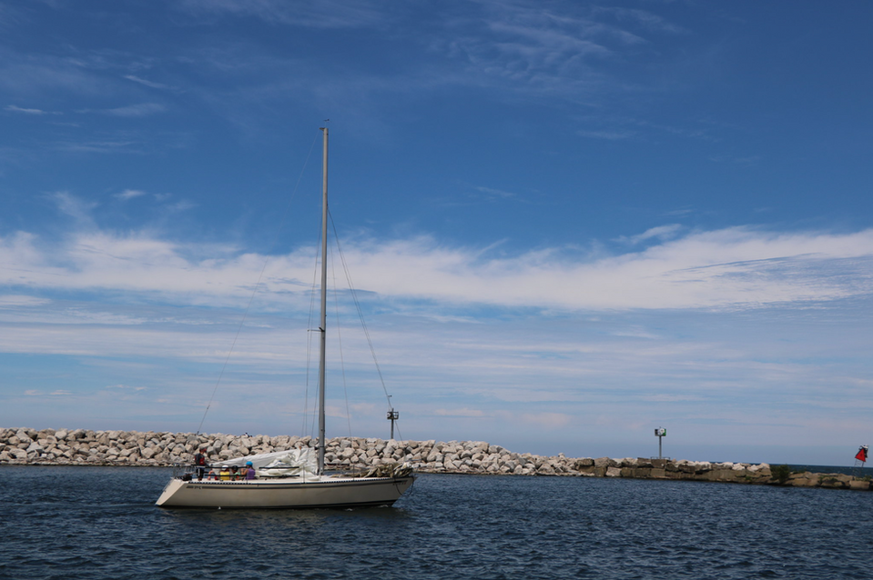 Sailboat in harbor channel