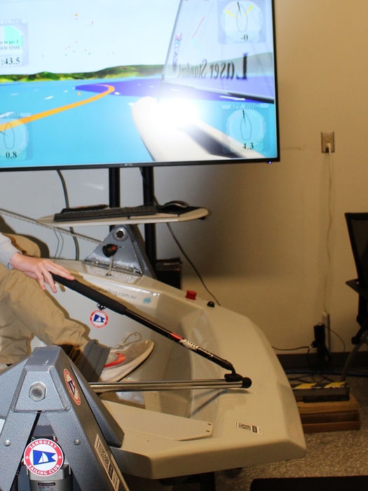 People interacting with a sailing simulator