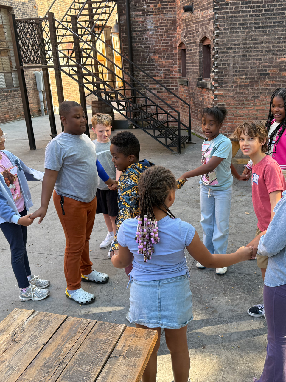 Children playing outdoors in a circle