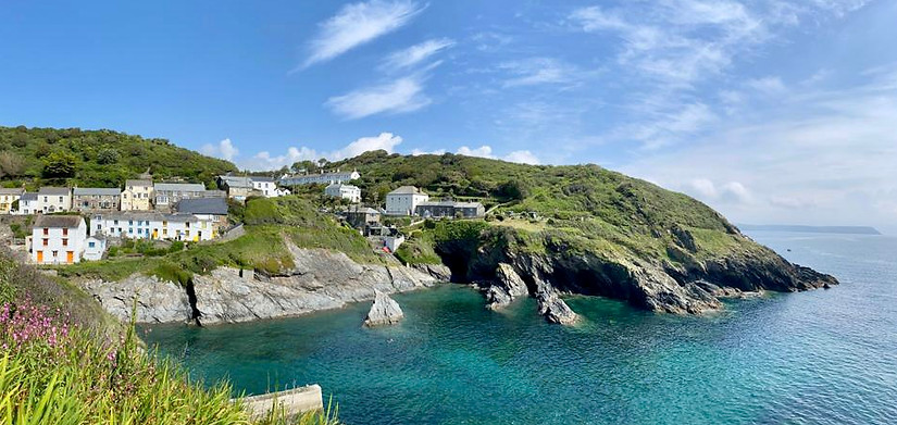 A view of Portloe village taken from the sea showing the shape of the inlet.