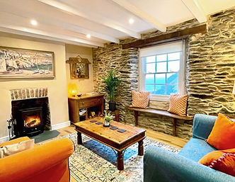 Cliff Villa's cozy warm sitting room with woodburner