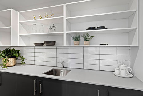 Modern butlers pantry with white tiles.