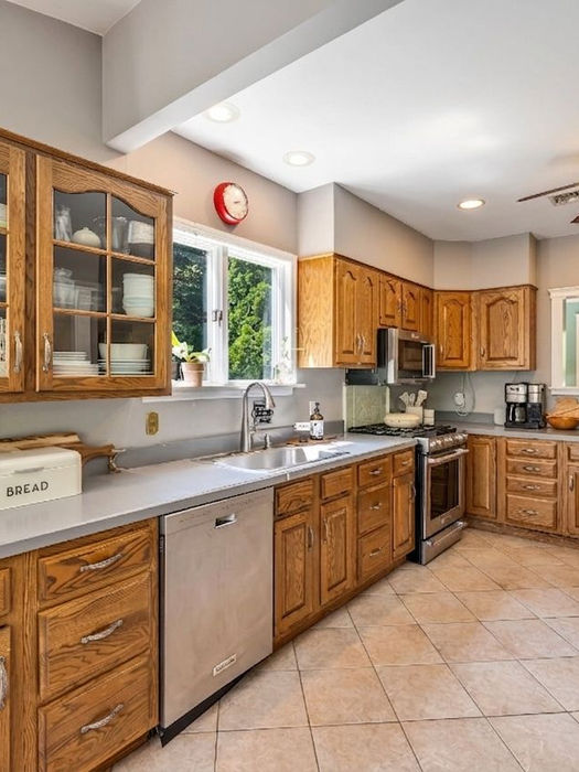 Bright kitchen with wood cabinetry and open layout in Montvale NJ luxury home in Northern New Jersey