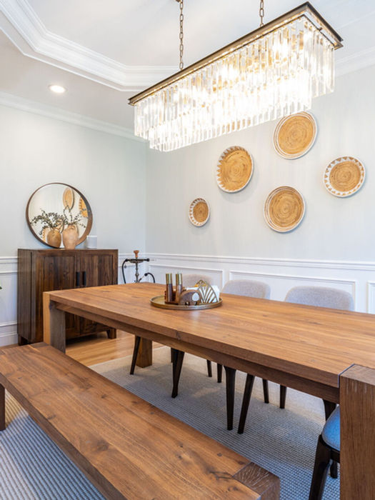 Formal dining room with modern chandelier, hardwood floors, and spacious layout in Bergen County luxury rental