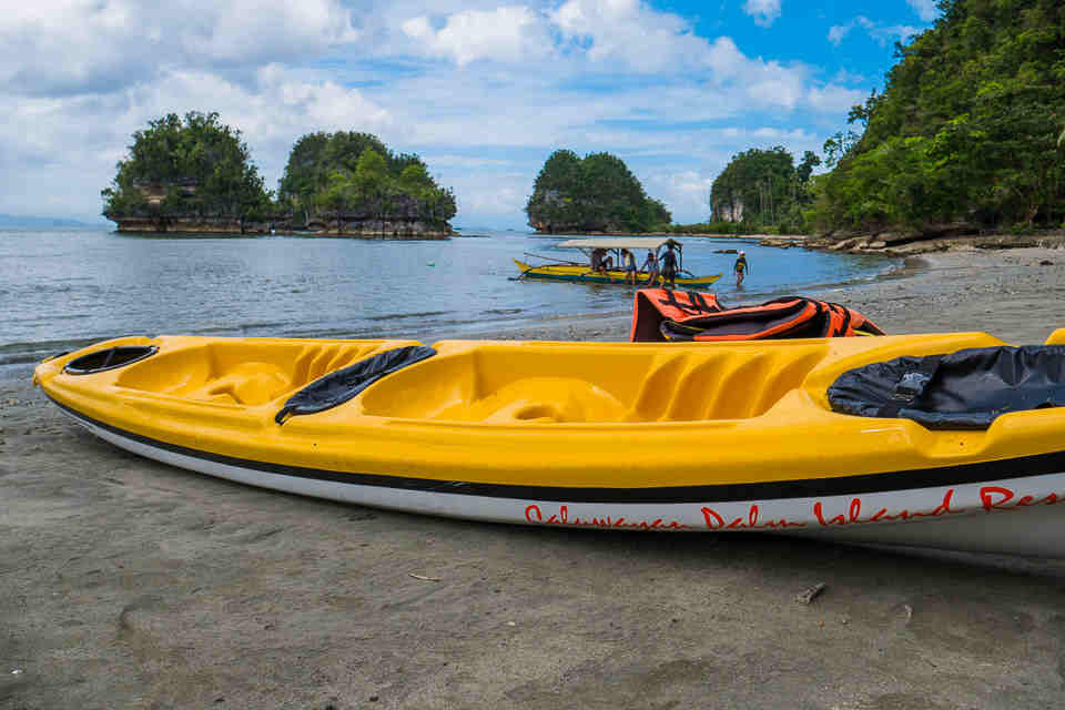 Kayaks Awaiting By The Beach