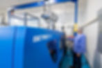 Accu-Mold Plastics Operator working a machine