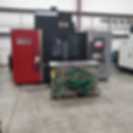 OKK CNC machine with a completed tool in front of it