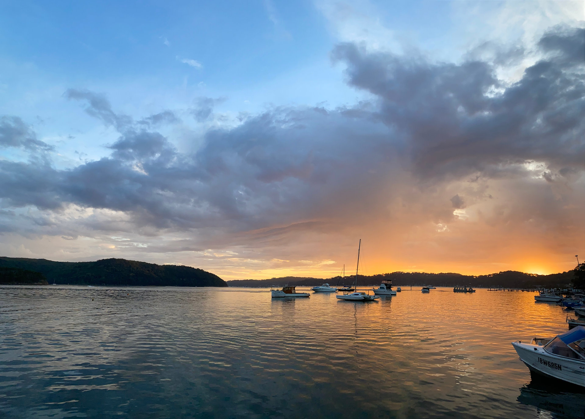 Boats moored at sunset on Pittwater