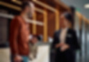 happy-man-communicating-with-black-female-concierge-hotel-hallway_1326977-17952.jpg
