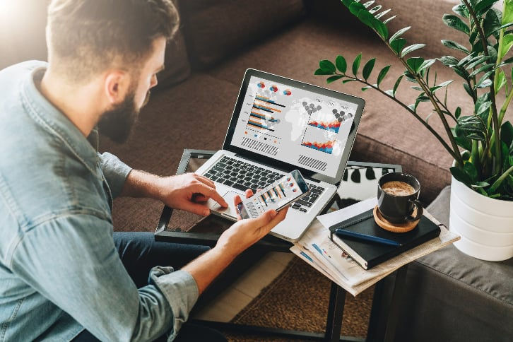 Person working on multiple computers