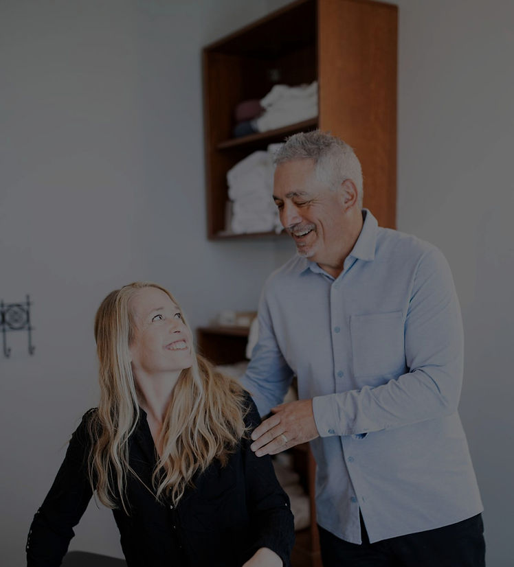 Experienced Calgary chiropractor providing hands-on care to patient