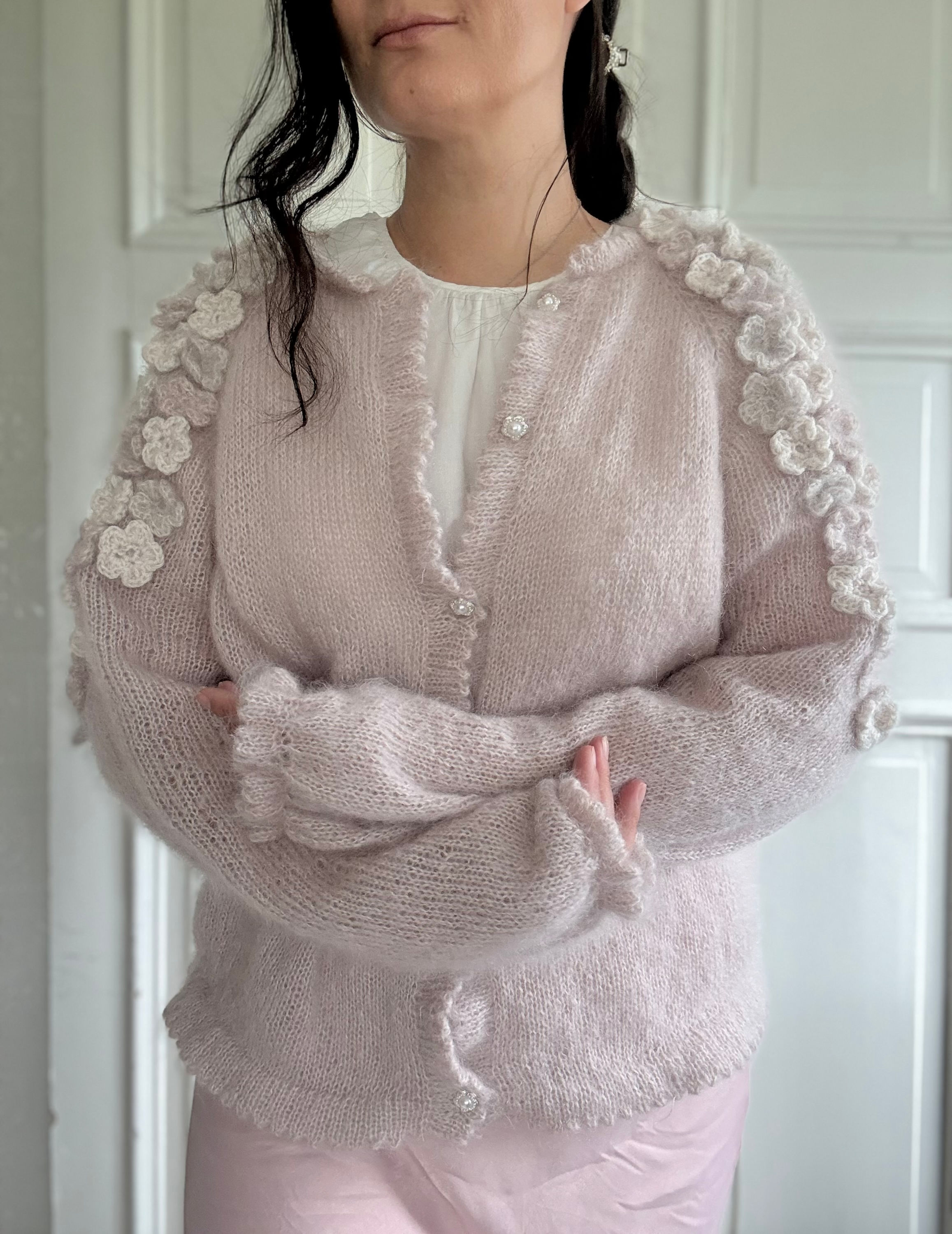 Blooming Cardigan by MyChicKnits — a feminine knitting pattern by Marthe Øyrås with crocheted flowers.