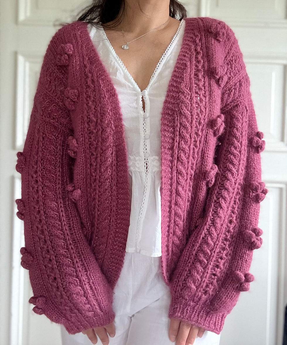 Thumbnail: I do2 Cardigan by MyChicKnits - a delicate knitting pattern my Marthe Øyrås featuring bobbles, cables and eyelets