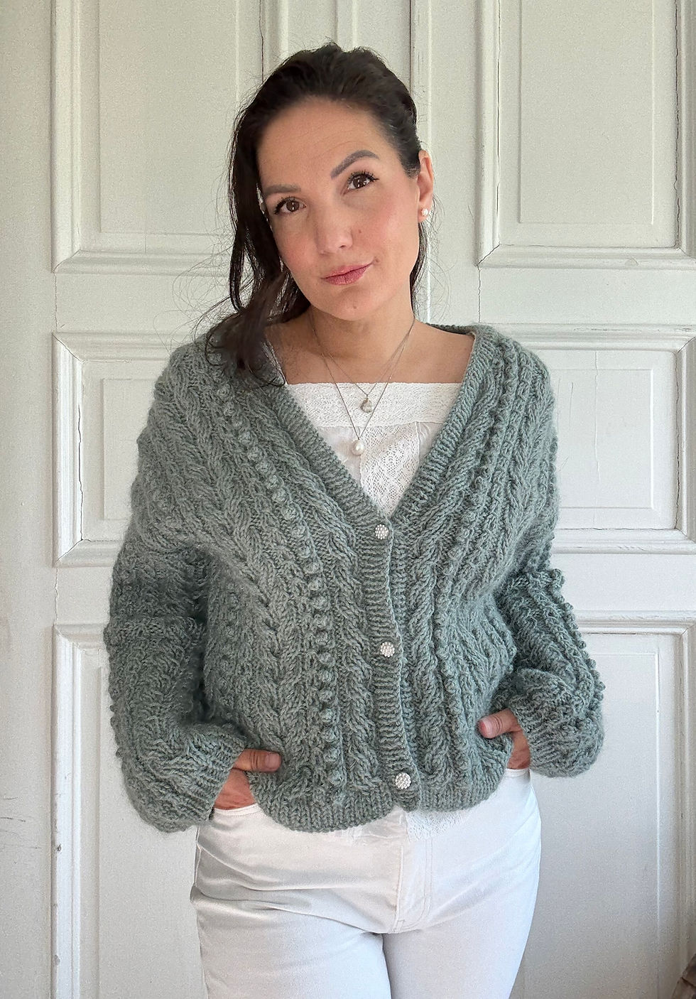 Thumbnail: Frostberry Cardigan by MyChicKnits — a textured knitting pattern by Marthe Øyrås with cables and bobbles.