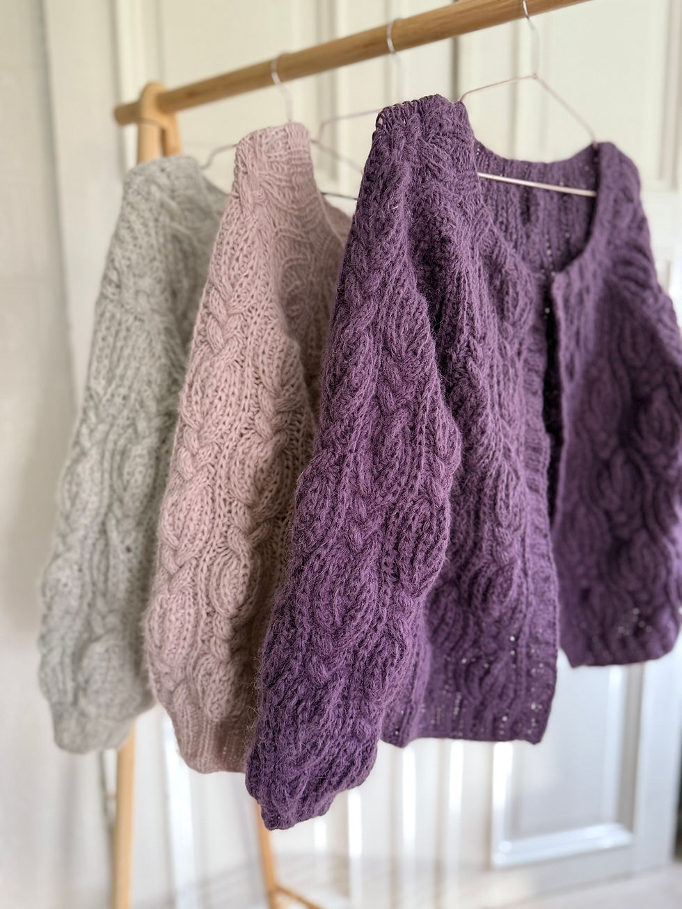 Thumbnail: Fluffy Cable Cardigan by MyChicKnits — a timeless knitting pattern by Marthe Øyrås with voluminous cables and fluffy texture.