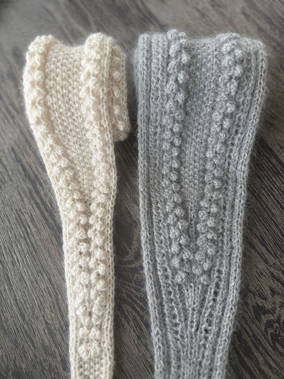 Thumbnail: Pearl Scarf by MyChicKnits — a feminine mini-scarf knitting pattern by Marthe Øyrås with bobble and pearl texture.
