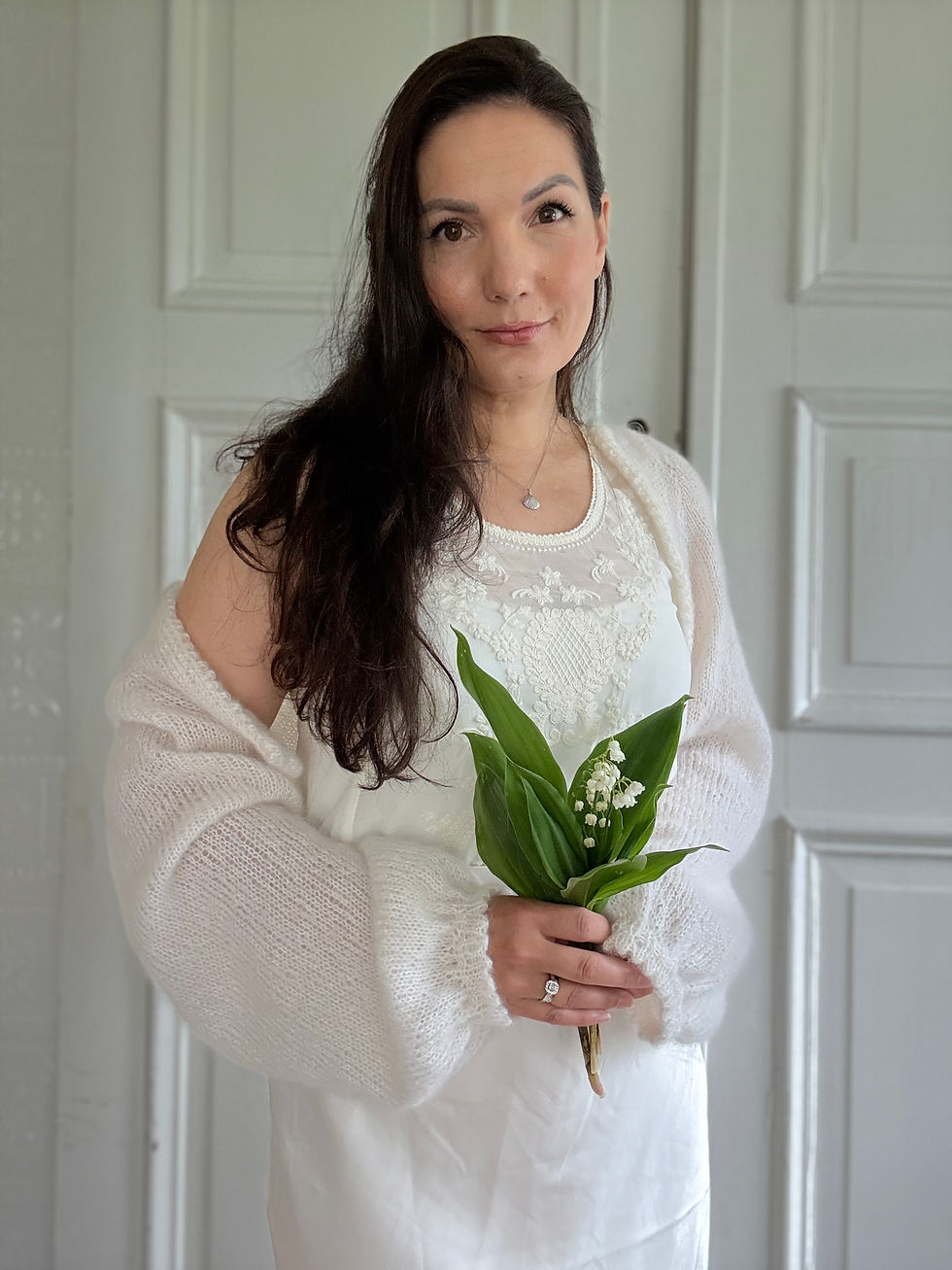 Thumbnail: Cutest Bridal Cardigan by MyChicKnits - a delicate knitting pattern my Marthe Øyrås featuring long sleeves & picot edging