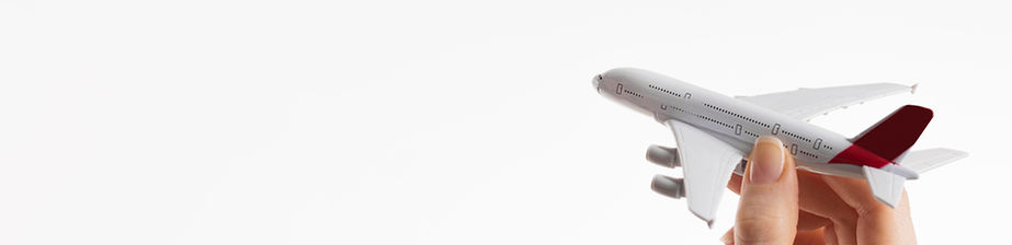 hand-holding-airplane-figurine-with-copy