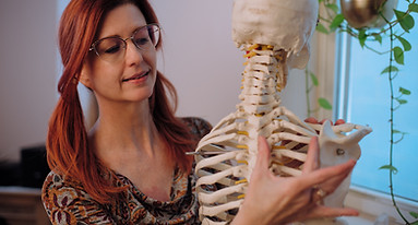 Yoga Therapist explaining shoulder blade