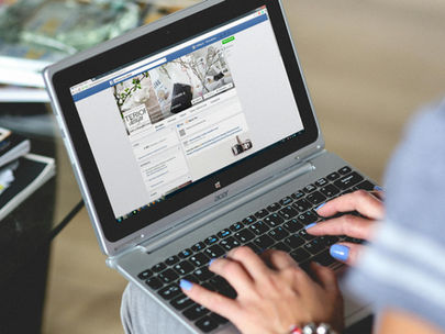 woman with laptop on facebook