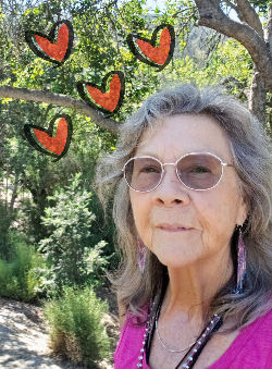 Patricia with hearts giving gratitude and appreciation
