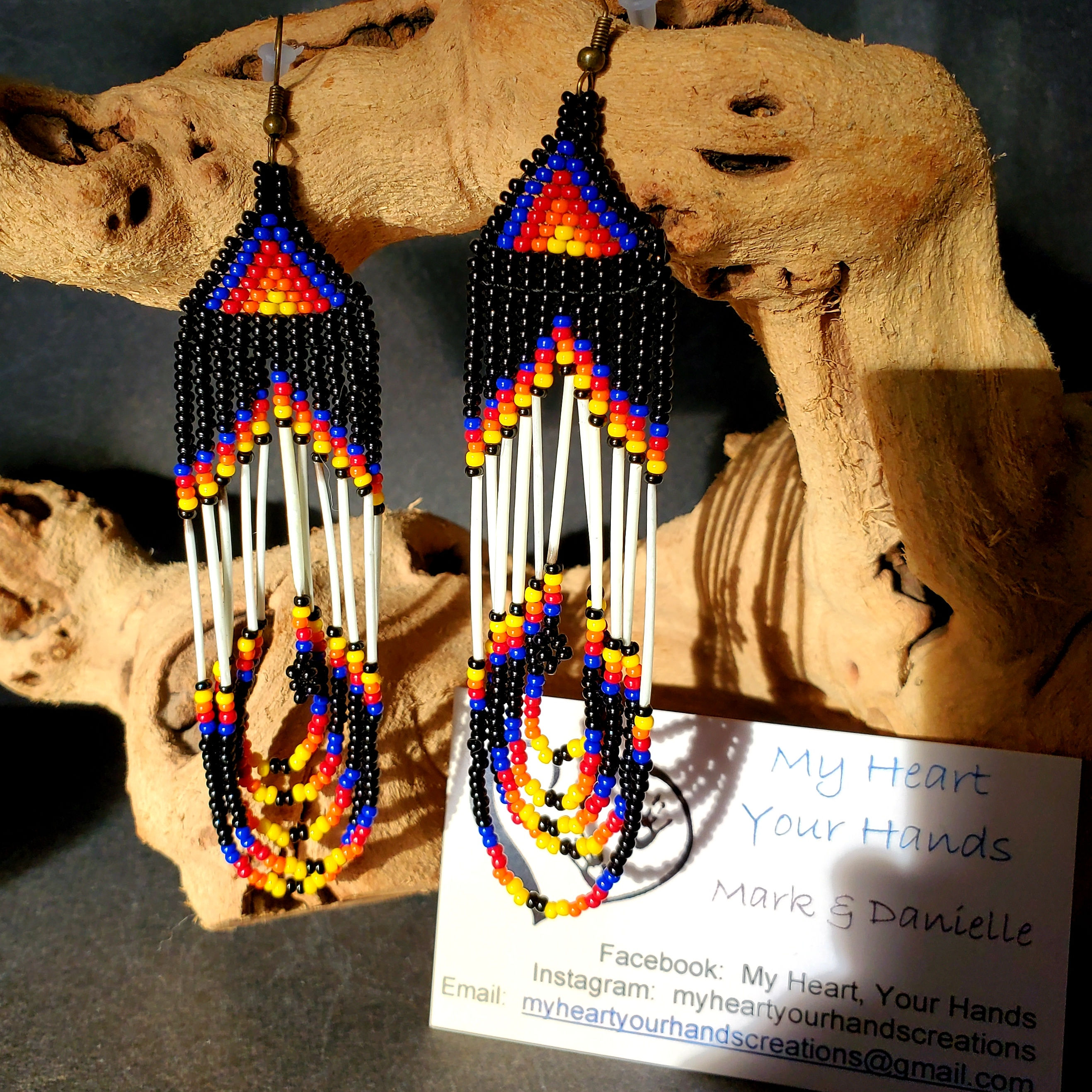 Black swoop quill earrings