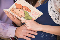Close-up of hands holding a children's book.