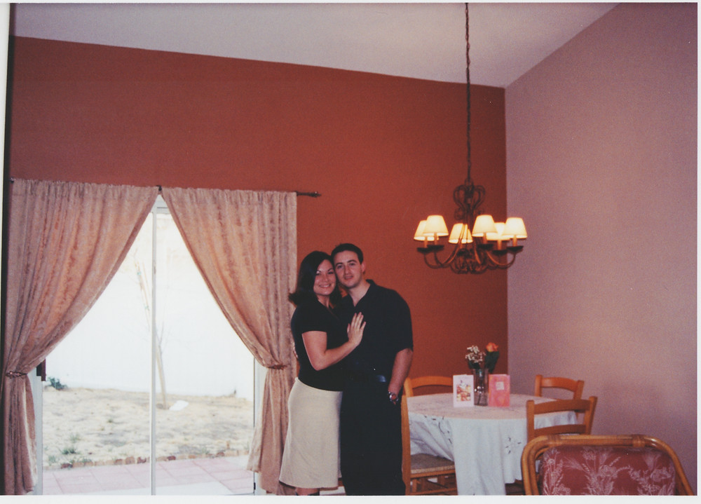 Us in our first home, cheesy pose.