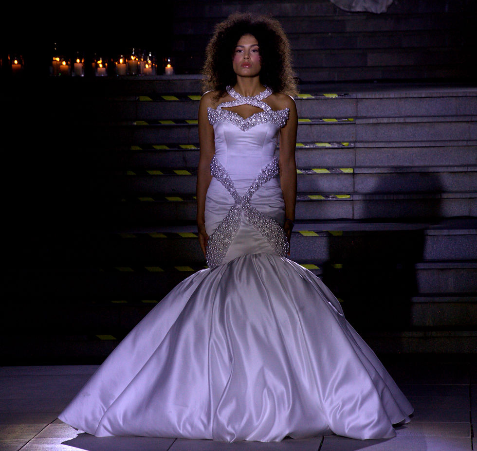 curly haired girl in a gown