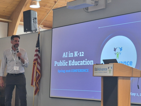 matt mervis addresses audience at conference with edadvance logo