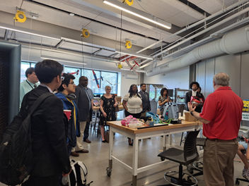 student listen in on tour of university of Hartford labs
